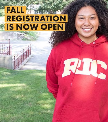 Student smiling in 鶹ԭ sweatshirt-promoting fall registration now open
