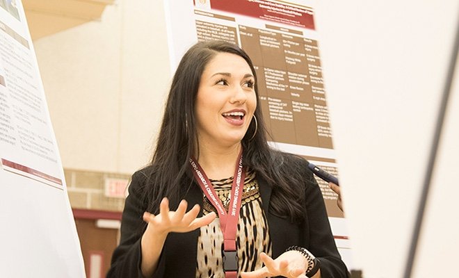 Graduate student at poster presentation